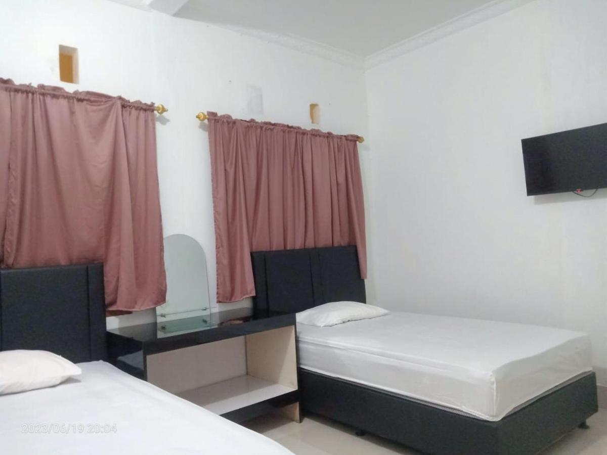 Permata Homestay Kotamobagu Mitra Reddoorz Экстерьер фото